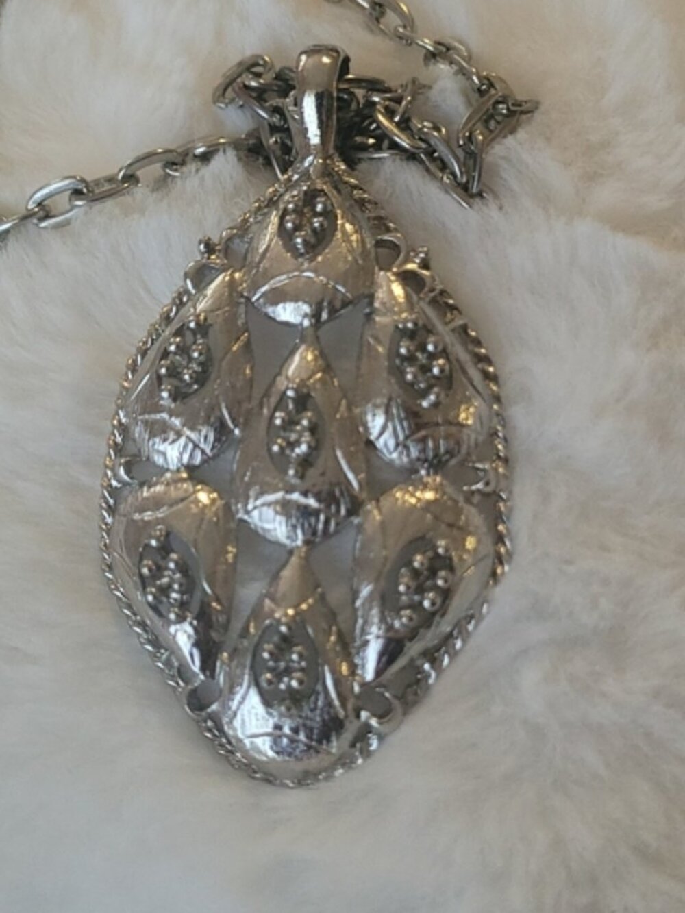 Necklace with pendant.